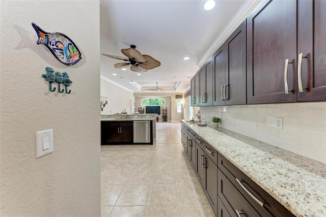 5359 90th Avenue Cir E, Parrish, FL 34219 - kitchen featuring a ceiling fan, decorative backsplash, stainless steel dishwasher, light stone counters, and crown molding