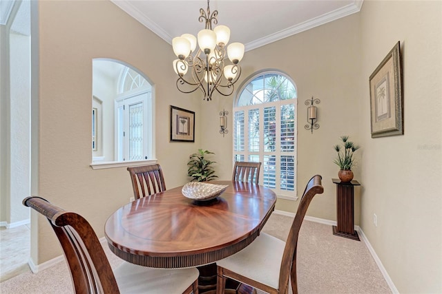 5359 90th Avenue Cir E, Parrish, FL 34219 - dining area featuring carpet, arched walkways, ornamental molding, a chandelier, and baseboards