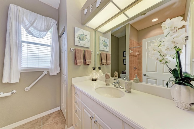 5359 90th Avenue Cir E, Parrish, FL 34219 - bathroom with tiled shower, vanity, baseboards, and tile patterned floors