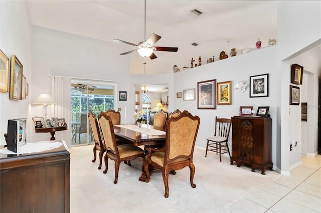 6405 Alesheba Ln, Sarasota, FL 34240 - dining room with ceiling fan, high vaulted ceiling, light carpet, and baseboards