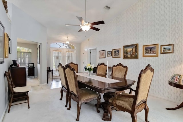 6405 Alesheba Ln, Sarasota, FL 34240 - dining room featuring wallpapered walls, light carpet, french doors, and ceiling fan