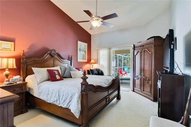 6405 Alesheba Ln, Sarasota, FL 34240 - bedroom featuring access to exterior, light colored carpet, a ceiling fan, and high vaulted ceiling