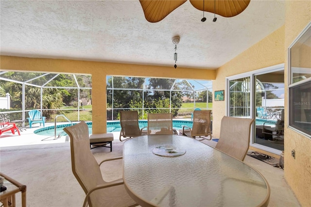6405 Alesheba Ln, Sarasota, FL 34240 - view of patio / terrace with an outdoor pool, outdoor dining space, and glass enclosure
