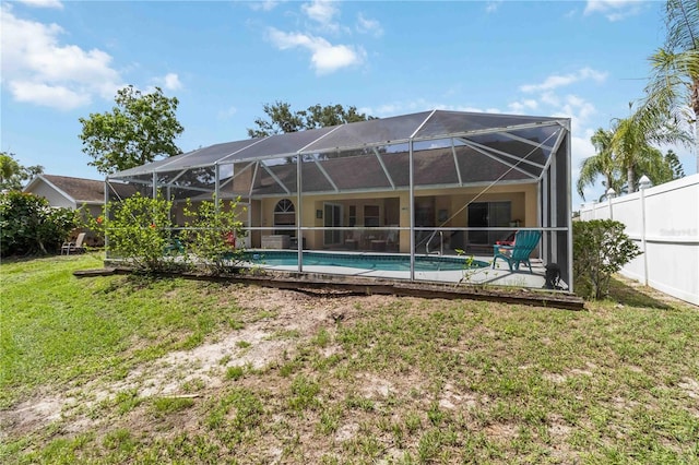 6405 Alesheba Ln, Sarasota, FL 34240 - rear view of property with an outdoor pool, glass enclosure, and a patio