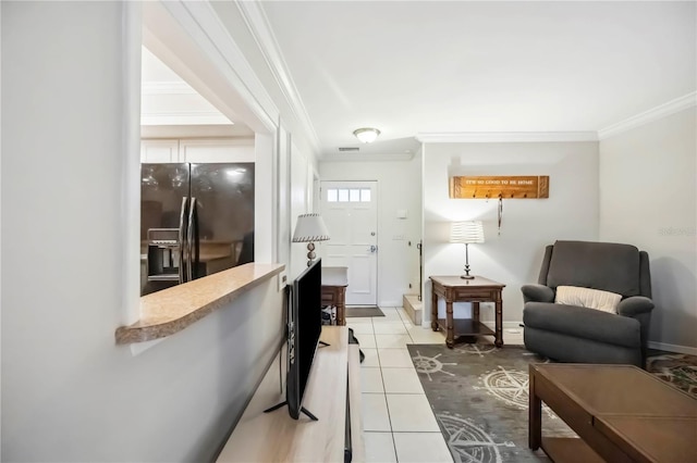 6860 Whitman Ct Unit 32B, Sarasota, FL 34243 - living room with crown molding, light tile patterned floors, and baseboards