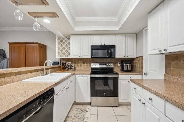 6860 Whitman Ct Unit 32B, Sarasota, FL 34243 - kitchen with black appliances, a sink, crown molding, a tray ceiling, and light tile patterned flooring