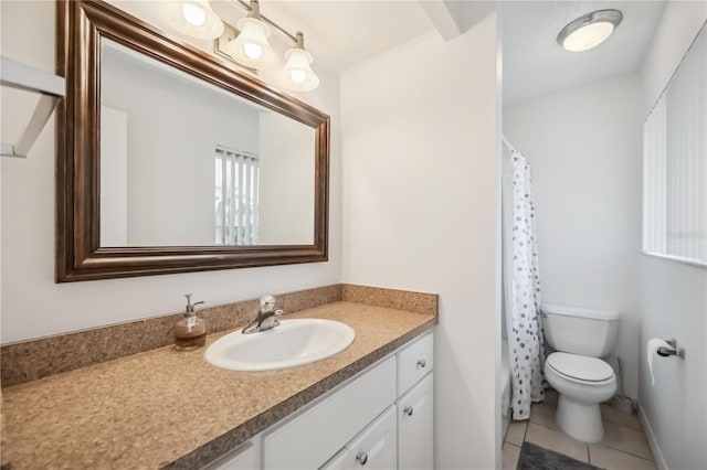 6860 Whitman Ct Unit 32B, Sarasota, FL 34243 - full bathroom with vanity, toilet, tile patterned flooring, and a shower with shower curtain