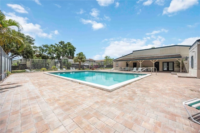 6860 Whitman Ct Unit 32B, Sarasota, FL 34243 - community pool featuring french doors and a patio area