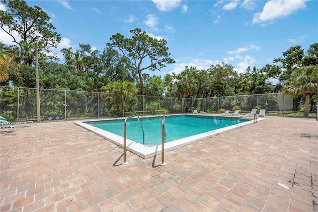 6860 Whitman Ct Unit 32B, Sarasota, FL 34243 - community pool with a patio area and view of wooded area