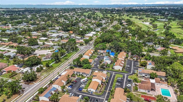 6860 Whitman Ct Unit 32B, Sarasota, FL 34243 - aerial view of property and surrounding area featuring nearby suburban area and a golf course