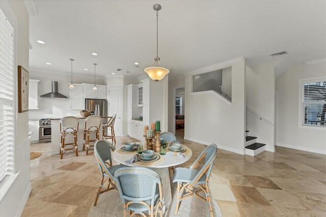 634 Key Royale Dr, Holmes Beach, FL 34217 - dining room with stairway, crown molding, baseboards, and recessed lighting