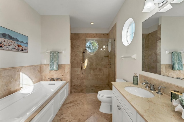 634 Key Royale Dr, Holmes Beach, FL 34217 - full bath featuring a garden tub, tiled shower, vanity, toilet, and tile walls