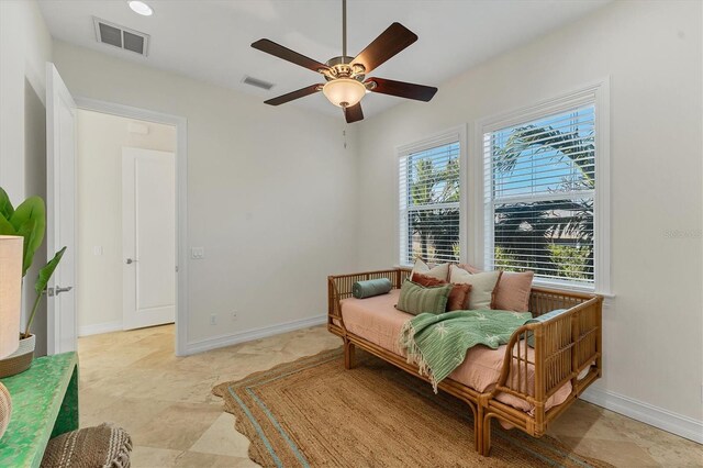 634 Key Royale Dr, Holmes Beach, FL 34217 - bedroom featuring multiple windows, baseboards, and a ceiling fan
