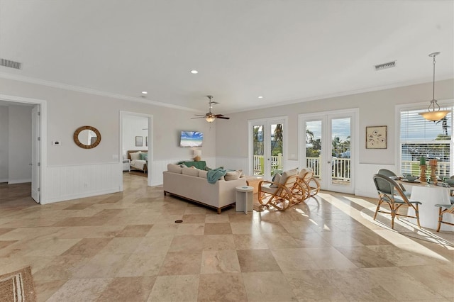634 Key Royale Dr, Holmes Beach, FL 34217 - living area featuring crown molding, wainscoting, ceiling fan, french doors, and recessed lighting