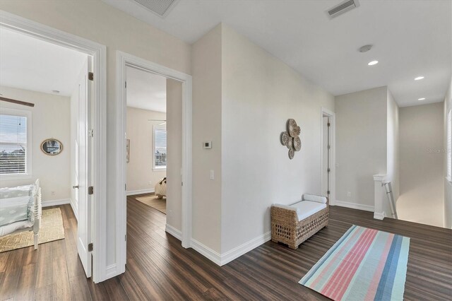 634 Key Royale Dr, Holmes Beach, FL 34217 - hall featuring dark wood-style flooring, baseboards, and recessed lighting