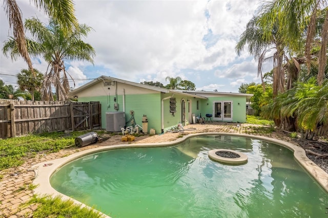 225 Sherwood Ln, Daytona Beach, FL 32117 - view of swimming pool with french doors and a fenced backyard