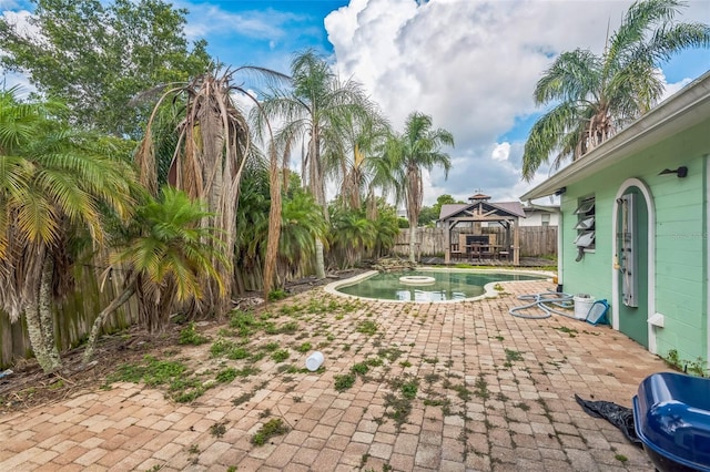 225 Sherwood Ln, Daytona Beach, FL 32117 - view of swimming pool featuring a gazebo, a patio area, and a fenced backyard