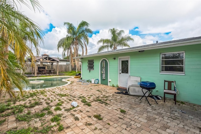 225 Sherwood Ln, Daytona Beach, FL 32117 - back of house featuring a gazebo and a patio area