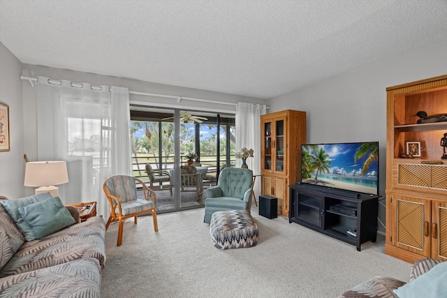 3500 El Conquistador Pkwy Unit 132, Bradenton, FL 34210 - carpeted living area featuring a textured ceiling and a ceiling fan