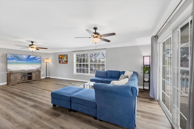 2005 21st St W, Palmetto, FL 34221 - living room with ceiling fan, ornamental molding, baseboards, and wood finished floors
