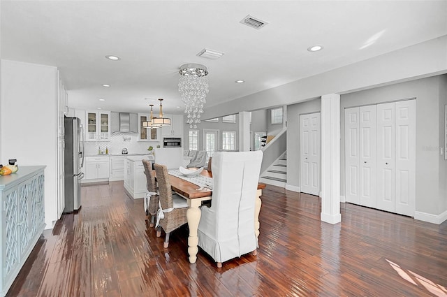 13514 4th Plz E, Bradenton, FL 34212 - dining room with a chandelier, recessed lighting, dark wood-type flooring, and stairs