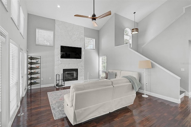 13514 4th Plz E, Bradenton, FL 34212 - living room with high vaulted ceiling, wood finished floors, a fireplace, ceiling fan, and stairway