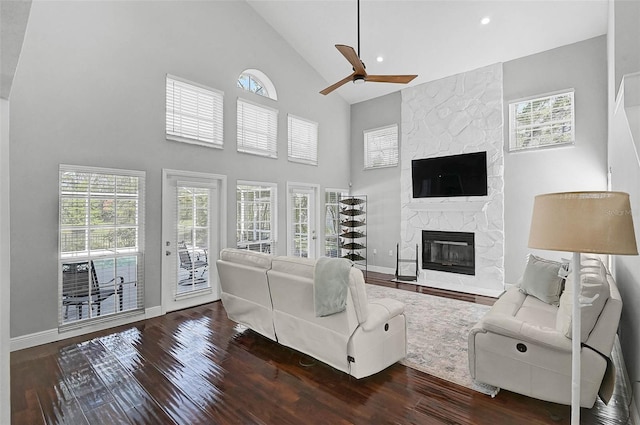 13514 4th Plz E, Bradenton, FL 34212 - living area featuring high vaulted ceiling, wood finished floors, a fireplace, healthy amount of natural light, and recessed lighting