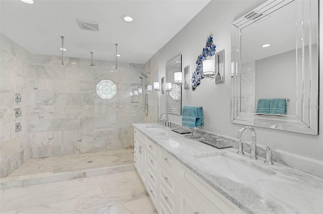 13514 4th Plz E, Bradenton, FL 34212 - full bathroom featuring double vanity, a tile shower, recessed lighting, and marble finish floors
