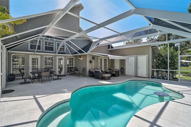 13514 4th Plz E, Bradenton, FL 34212 - swimming pool featuring french doors, a patio, an outdoor living space, and glass enclosure