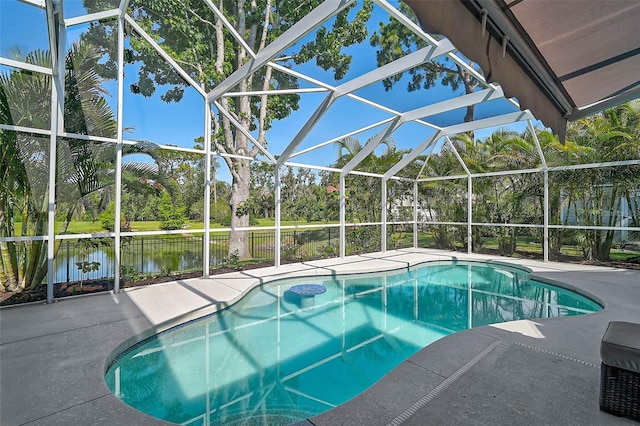 13514 4th Plz E, Bradenton, FL 34212 - outdoor pool featuring a patio, a lanai, a water view, and view of wooded area
