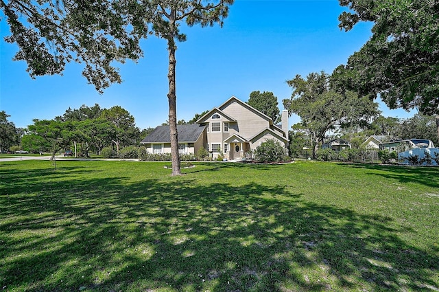 13514 4th Plz E, Bradenton, FL 34212 - view of home's exterior with a yard