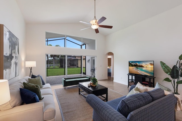 12031 Longview Lake Cir, Lakewood Ranch, FL 34211 - living room featuring arched walkways, a ceiling fan, and high vaulted ceiling