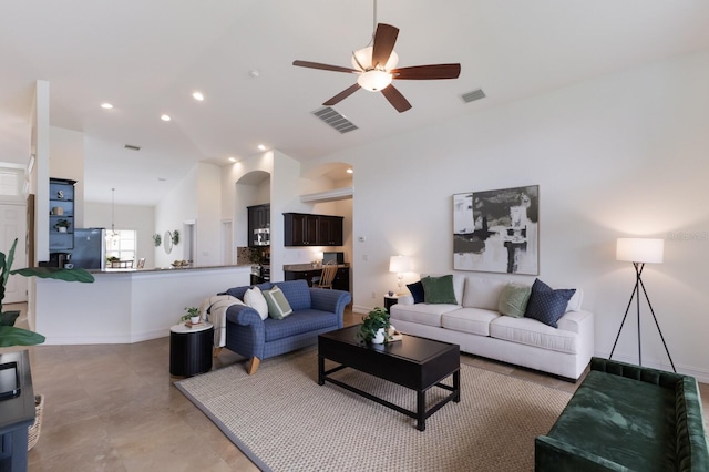 12031 Longview Lake Cir, Lakewood Ranch, FL 34211 - living room featuring ceiling fan, lofted ceiling, baseboards, recessed lighting, and arched walkways