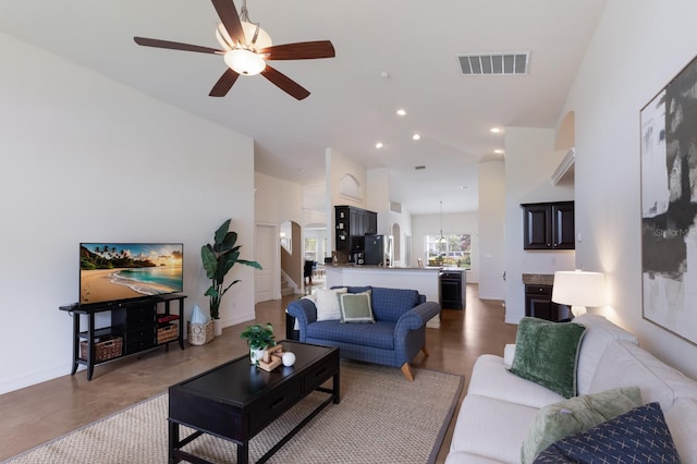 12031 Longview Lake Cir, Lakewood Ranch, FL 34211 - living room with a ceiling fan, arched walkways, recessed lighting, stairway, and baseboards