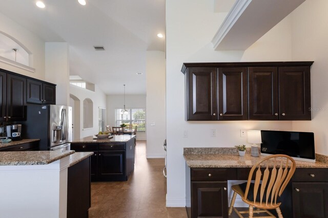 12031 Longview Lake Cir, Lakewood Ranch, FL 34211 - kitchen featuring stainless steel refrigerator with ice dispenser, a kitchen island, baseboards, light stone counters, and recessed lighting