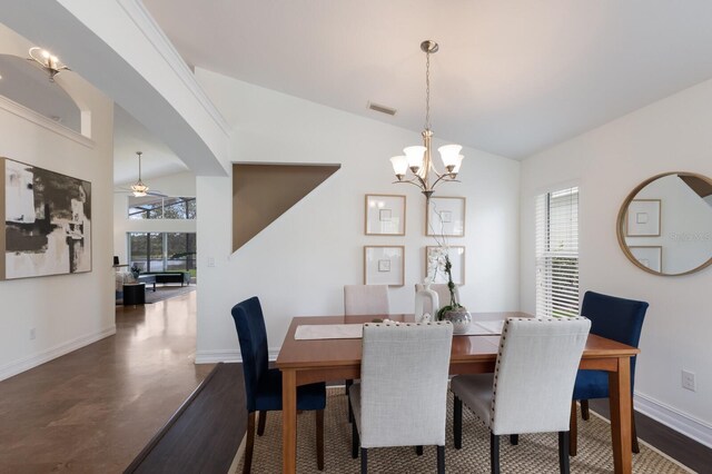 12031 Longview Lake Cir, Lakewood Ranch, FL 34211 - dining space with lofted ceiling, baseboards, and a chandelier