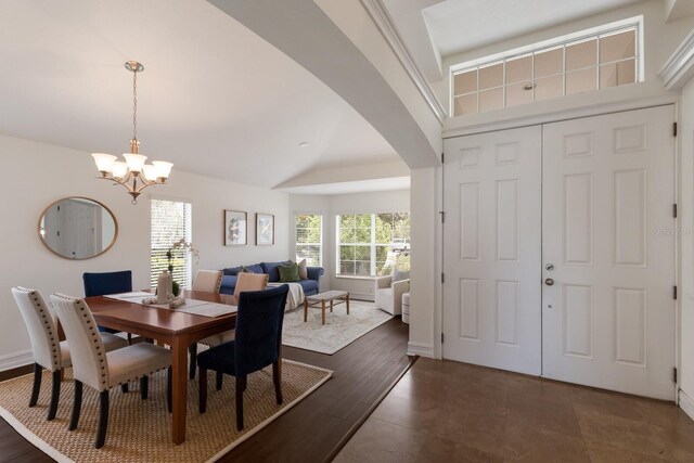 12031 Longview Lake Cir, Lakewood Ranch, FL 34211 - dining area featuring a chandelier, arched walkways, and baseboards