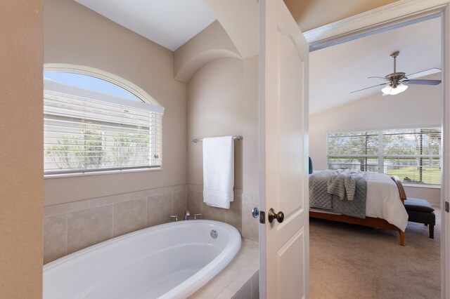 12031 Longview Lake Cir, Lakewood Ranch, FL 34211 - ensuite bathroom featuring a bath, a ceiling fan, and vaulted ceiling