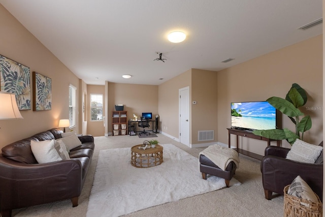 12031 Longview Lake Cir, Lakewood Ranch, FL 34211 - living room with light carpet, baseboards, and an office area