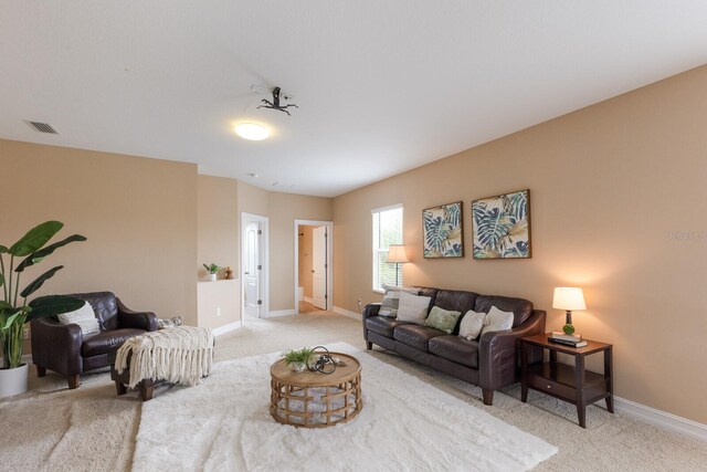 12031 Longview Lake Cir, Lakewood Ranch, FL 34211 - living area featuring light colored carpet and baseboards