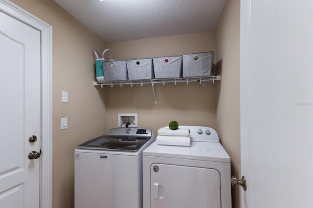 12031 Longview Lake Cir, Lakewood Ranch, FL 34211 - washroom featuring washing machine and dryer and a textured ceiling