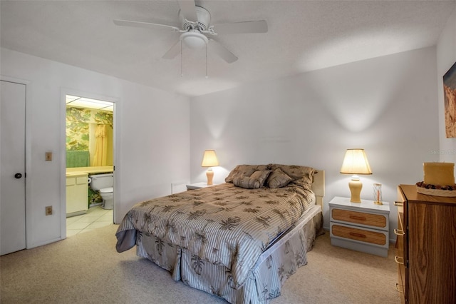 3500 El Conquistador Pkwy Unit 128, Bradenton, FL 34210 - carpeted bedroom with ensuite bathroom and a ceiling fan