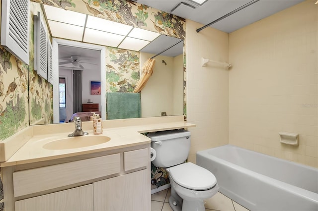 3500 El Conquistador Pkwy Unit 128, Bradenton, FL 34210 - full bathroom with wallpapered walls, vanity, washtub / shower combination, a ceiling fan, and tile patterned flooring