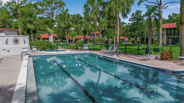 3500 El Conquistador Pkwy Unit 128, Bradenton, FL 34210 - community pool with a patio area and a community hot tub