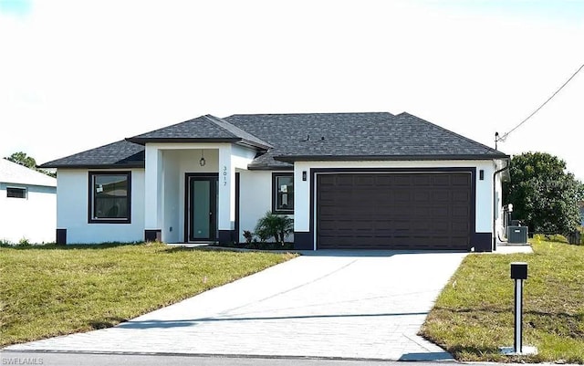 3017 4th St W, Lehigh Acres, FL 33971 - view of front of home featuring concrete driveway, stucco siding, an attached garage, a front lawn, and roof with shingles