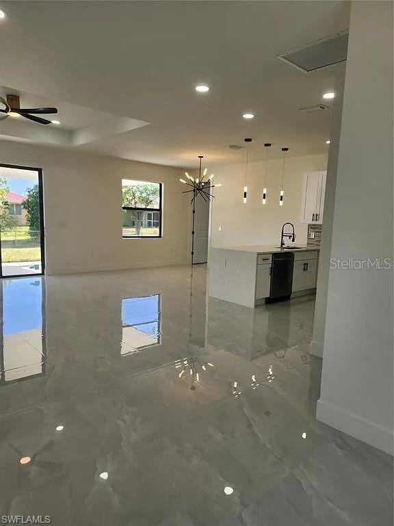 3017 4th St W, Lehigh Acres, FL 33971 - spare room with recessed lighting, baseboards, light marble finish floors, a ceiling fan, and a sink