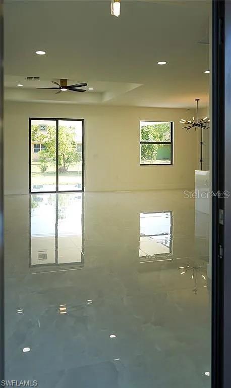 3017 4th St W, Lehigh Acres, FL 33971 - empty room featuring ceiling fan and recessed lighting
