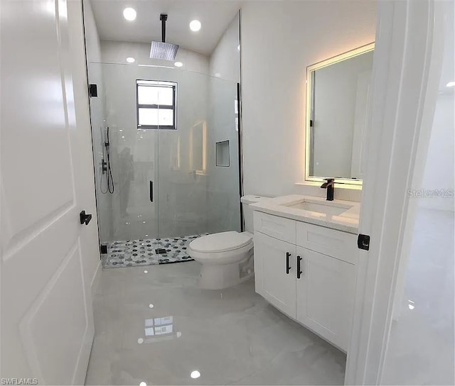 3017 4th St W, Lehigh Acres, FL 33971 - full bathroom with a shower stall, vanity, toilet, and tile patterned floors