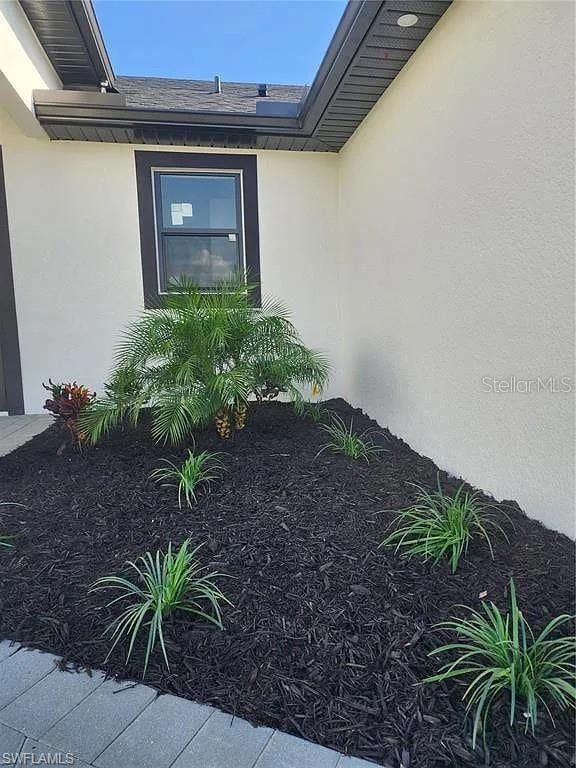 3017 4th St W, Lehigh Acres, FL 33971 - entrance to property with stucco siding