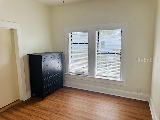 1412 12th Ave W, Bradenton, FL 34205 - spare room featuring wood finished floors and baseboards